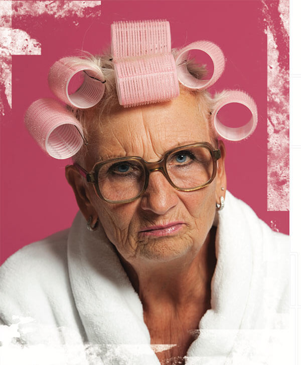 woman wearing pink curlers